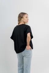 Buzo verde agua de algodón grueso, manga corta y corte oversize.