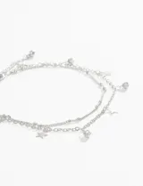 Tobillera dorada de doble cadena con dije de estrella y strass.