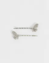 Set de dos horquillas plateadas para el pelo con forma de mariposa decorada con strass.