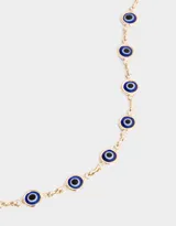 Collar corto dorado con cadena de eslabones y dijes de ojos turcos azules.