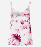 Blusa de viscosa satinada con estampado floral, breteles finos ajustables, escote en pico y volado diagonal.