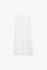Falda midi blanca de lino, con cintura elástica ajustable con cordones y corte evasé.