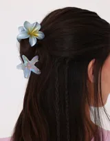 Set de dos broches para el pelo con forma de flor hawaiana y estrella de mar, color beige.