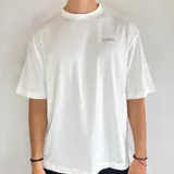 Remera negra de corte amplio, con estampa en la espalda con la frase "Push Your Limit Since October 2023" en color rosa y blanco.