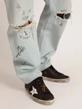 Zapatillas Golden Goose modelo Super-Star, color negro con estrella lateral blanca y refuerzo del talón blanco.