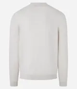 Suéter de punto color borgoña, con cuello redondo, sisas ligeramente desplazadas y bajo y puños acanalados.