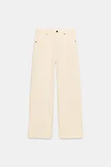 Pantalón de jean negro con efecto lavado, corte wide leg y tiro alto.