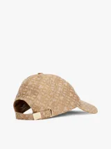 Gorra de béisbol beige con monograma TH en relieve.