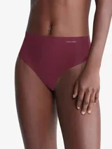 Colaless de talle alto color borgoña, de microfibra elástica sin costuras, con logo de Calvin Klein en la cintura.