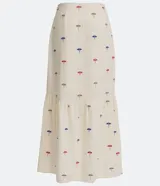 Pollera midi color crudo con estampado de sombrillas de colores. Tiene corte evasé, cintura alta con botones de colores y forro interior.