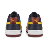 Championes Puma RBD Game Low, color azul marino con detalles en blanco, amarillo y rojo.