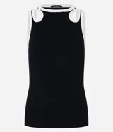 Blusa sin mangas confeccionada en rib de viscosa y elastano, color negro con ribete blanco. Posee breteles anchos con aberturas cutout en formato gotas y cuello redondo.
