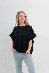 Buzo verde agua de algodón grueso, manga corta y corte oversize.