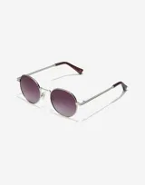 Gafas de sol unisex con montura plateada redonda y lentes degradadas de color uva.