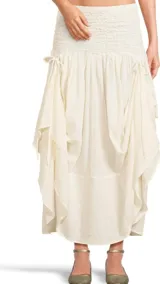 Pollera larga color crudo, con cintura elastizada y lazos laterales.