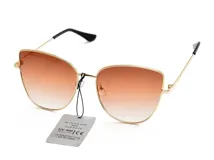 Lentes de sol con montura metálica dorada y lentes degradadas en tonos marrones. Diseño cat eye.