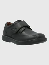 Zapato de cuero negro con ajuste de velcro y suela de goma EVA.
