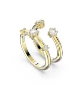 Conjunto de dos anillos Swarovski color dorado con cristales blancos redondos engarzados.