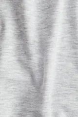 Pantalón largo de punto suave color gris melange, de tiro alto, corte amplio y cintura elástica.