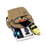 Morral de tela canvas color marrón, con correa regulable, asa de mano, cierre superior, dos bolsillos frontales con cierre, llavero exterior, bolsillos internos y bolsillo trasero con cierre.