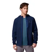Campera tipo softshell con capucha, color azul marino, cierre frontal a presión y bolsillos laterales. Presenta un dobladillo trasero más largo para mayor cobertura.