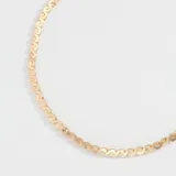 Correa dorada para lentes, hecha de metal con forma trenzada.