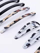 Set de 10 hebillas para el pelo con forma de pico de pato, con diferentes estampados animal print y lisas.