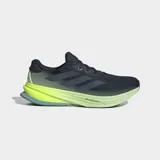 Championes de running Adidas Supernova Rise 2 para hombre, color negro con malla en la parte superior y detalles en verde lima fluorescente en la entresuela Dreamstrike+. La suela exterior es de color azul claro.