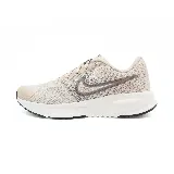 Zapatillas deportivas Nike Run Defy color beige con logo en el lateral.