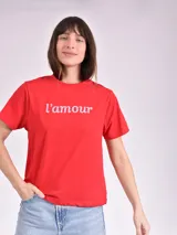 Remera celeste de algodón con estampado de flor y texto "Real View".