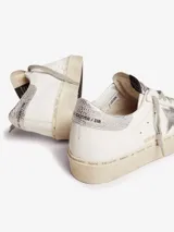Zapatillas Golden Goose modelo Hi Star, color blanco con estrella plateada y detalles en animal print.