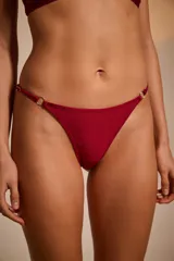 Colaless de lycra estampada en tonos rosa y verde con diseño abstracto.