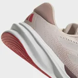 Championes de running Adidas Supernova Stride 2.0, color rosa pálido con detalles en blanco y suela en color borgoña.