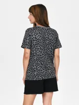 Remera color salmón con estampado de flor blanca y texto "Venice California".