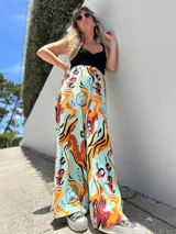 Maxi palazzo de lino con estampado multicolor y corte fluido.