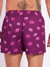 Bóxer de algodón blanco con estampado de flores pequeñas color celeste, con cintura elástica y logo de la marca en el centro.