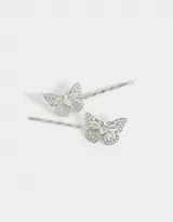 Set de dos horquillas plateadas para el pelo con forma de mariposa y strass.
