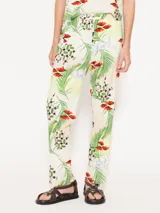 Pantalón babucha de algodón con estampado de hojas de palmera, flores rojas y cubos de hielo.