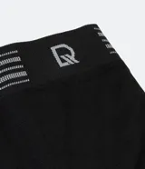 Calzoncillo bóxer blanco de poliamida, con cintura elástica a rayas grises y logo de la marca.