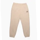 Pantalón de jogging color beige con puños elásticos y logo estampado en el muslo.