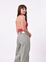 Body negro con cuello halter y espalda descubierta.