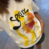 Remera blanca de algodón con estampado de un cóctel Spritz.