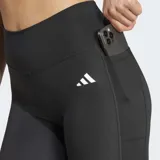 Calza deportiva negra de tiro alto y ajuste ceñido, confeccionada con tejido elástico y tecnología AEROREADY que absorbe la humedad. Presenta costuras selladas y un bolsillo oculto en el muslo.