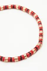 Collar tipo gargantilla con lentejuelas metálicas y plásticas color verde y dorado.