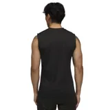 Musculosa deportiva Puma negra con estampado abstracto en gris oscuro, logo de Puma bordado en dorado y escudo del Club Atlético Peñarol bordado en dorado y negro.