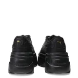 Championes Puma Karmen x de mujer, color negro con plataforma y detalles dorados.