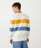 Suéter de punto de algodón con rayas horizontales en blanco, amarillo, azul y verde.