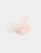 Broche para el pelo color rosa claro con forma de moño y lazo.