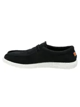 Alpargata negra con cordones elásticos y suela blanca con textura.