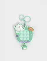 Llavero y charm pop it en forma de osito color verde agua, con detalles en blanco, naranja y violeta.